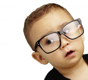 Small boy wearing big glasses